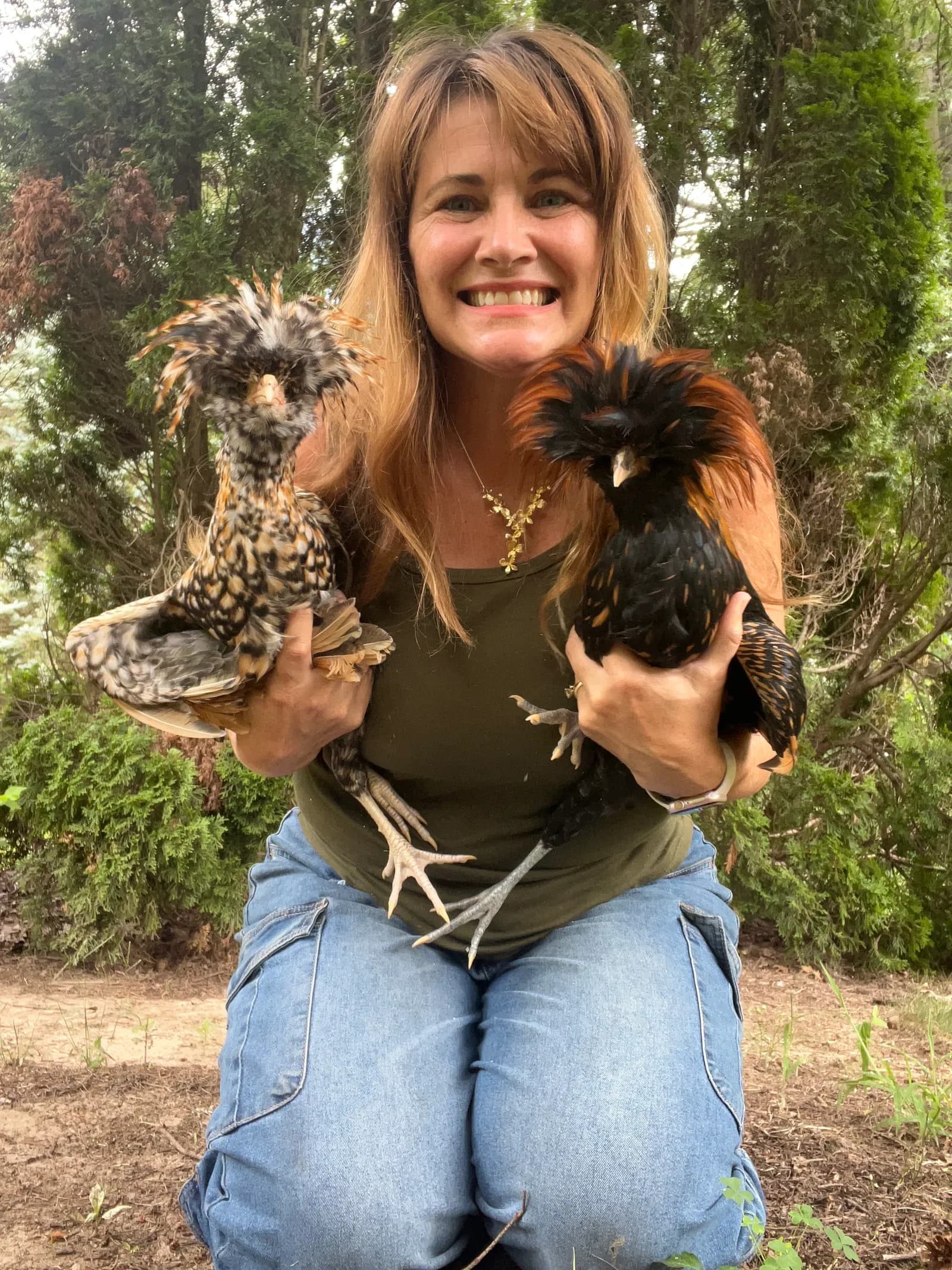Sarah with chickens on the farm